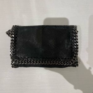 Black purse with chain stitching